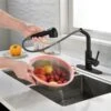 WELLFOR Sink Faucets Matte Black 1-handle Deck Mount Pull-out Handle/lever Residential Kitchen Faucet (Deck Plate Included)